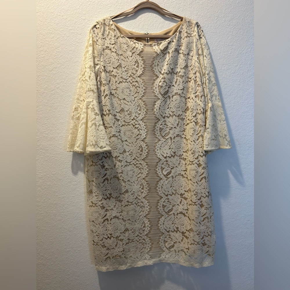 Beige dress size 18 with round neck, half sleeves and zipper at the back.